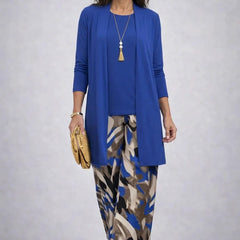 Blue 3-piece set with long cardigan, patterned midi skirt, and necklace
