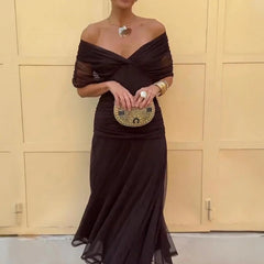 Brown off-shoulder maxi dress with draped neckline and sheer ruffle skirt