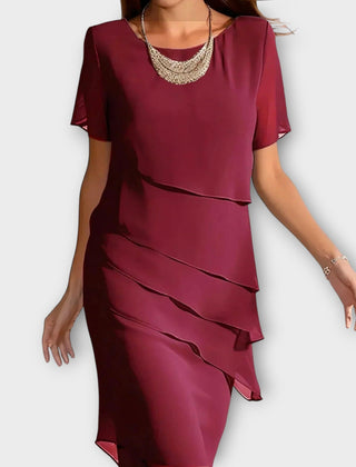 Red tummy-concealing dress with short sleeves, draped layered front and midi length.