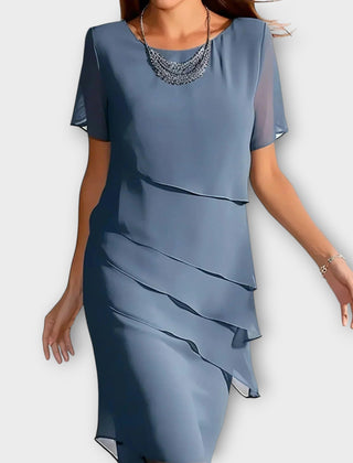 Blue tummy-concealing dress with short sleeves, draped layered front and midi length.