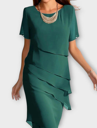 Green tummy-concealing dress with short sleeves, draped layered front and midi length.