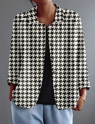 Black and white houndstooth button-up blouse with pointed collar