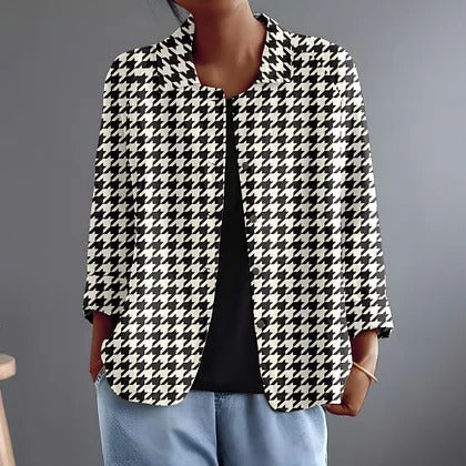 Black and white houndstooth button-up blouse with pointed collar