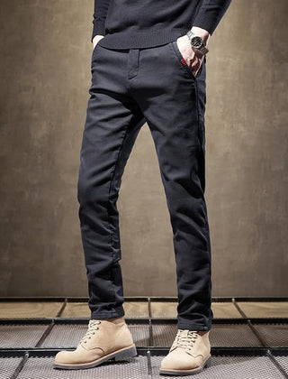 Black slim-fit pants front view with tapered slim fit