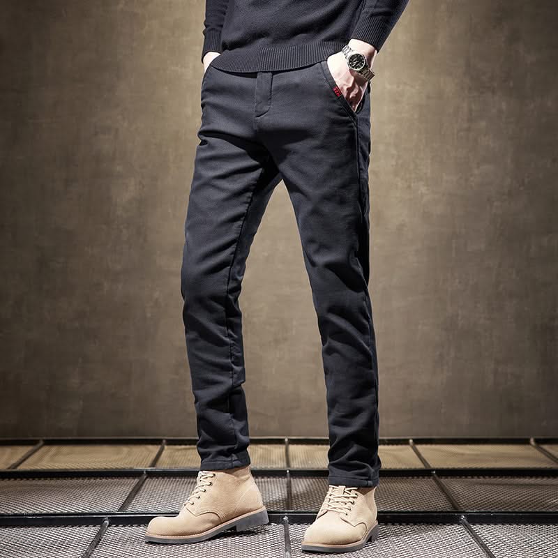 Black slim-fit pants front view with tapered slim fit