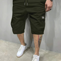 Army green utility shorts with drawstring waist and side cargo pockets
