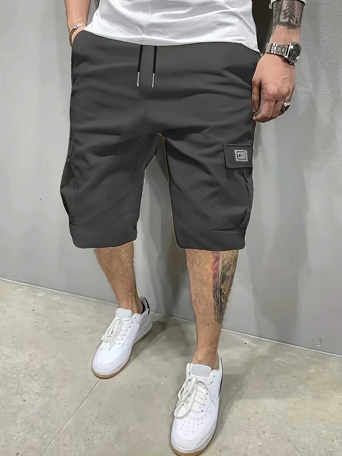 Charcoal utility shorts with drawstring waist and side cargo pockets