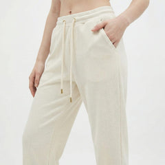 Cream cotton drawstring pants with elastic waistband
