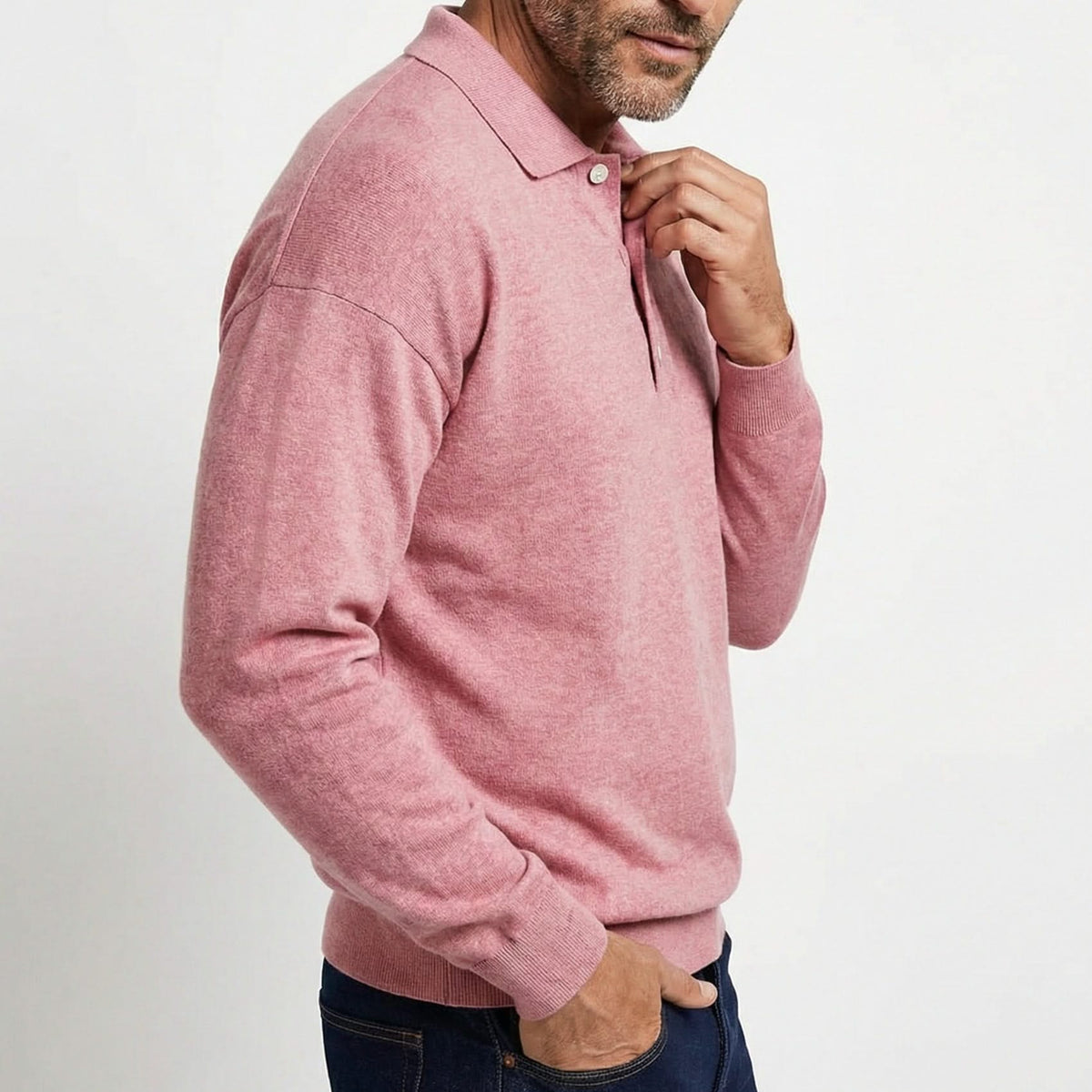 Pink wool polo shirt with long sleeves, button placket, and ribbed collar cuffs