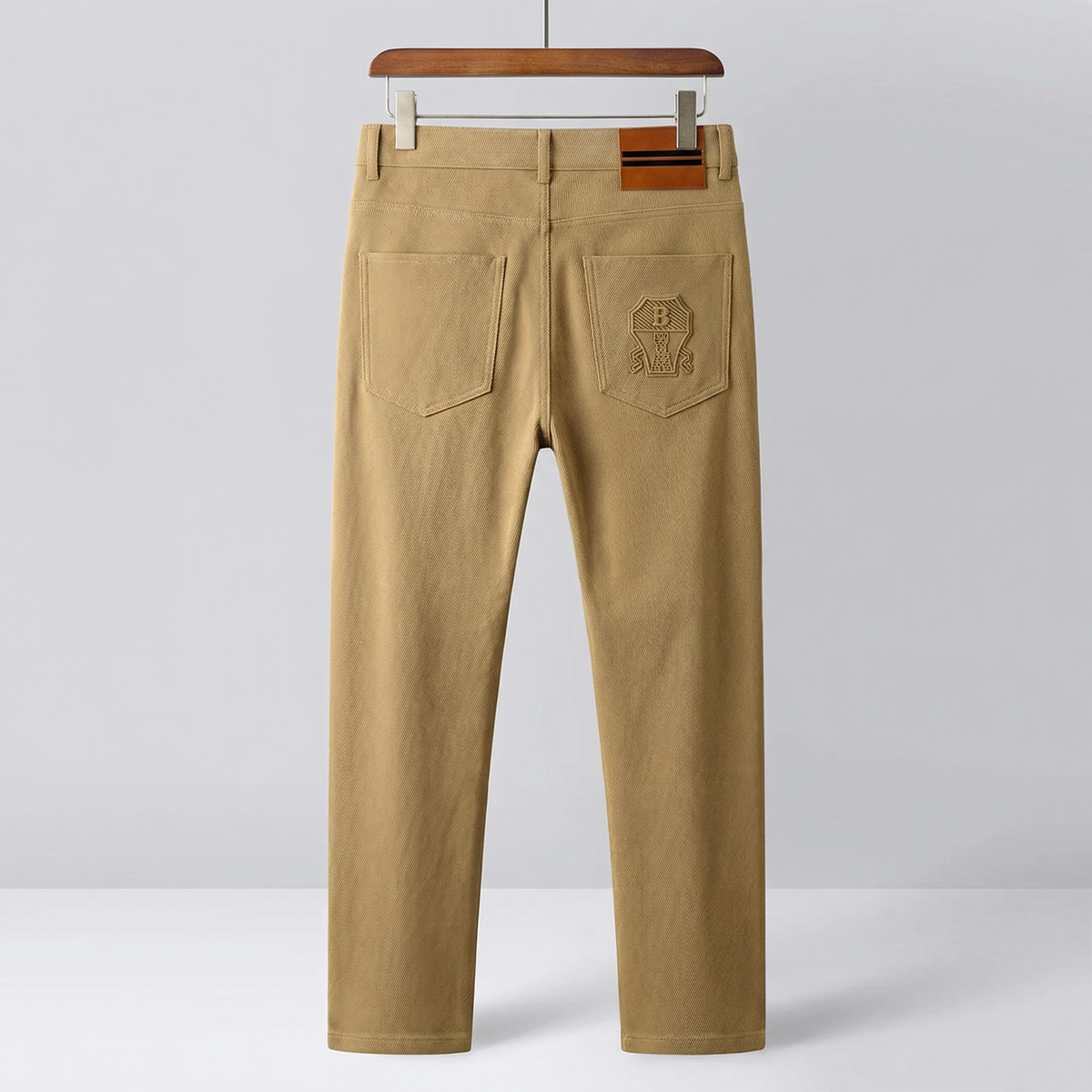 Khaki premium pants on hanger with front center crease and two side pockets