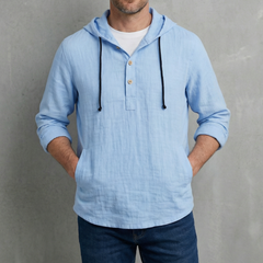 Blue hoodie shirt on model, with hood drawstrings and henley button placket.