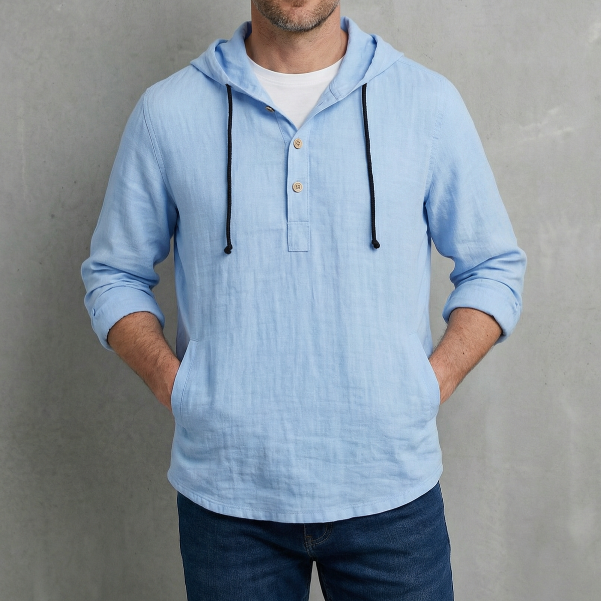Blue hoodie shirt on model, with hood drawstrings and henley button placket.