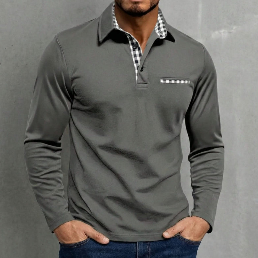 Long-sleeve polo shirt in dark grey, half-zip placket, gingham inner collar, chest pocket.