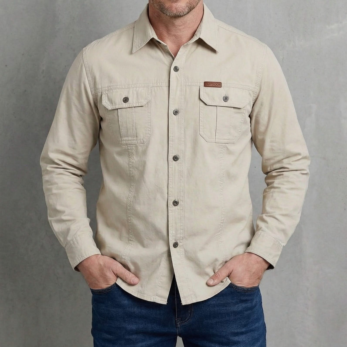 Beige utility adventure shirt with button-front, two chest pockets, and long sleeves