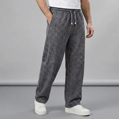 Charcoal textured tapered pants with elastic waistband and drawstring ties