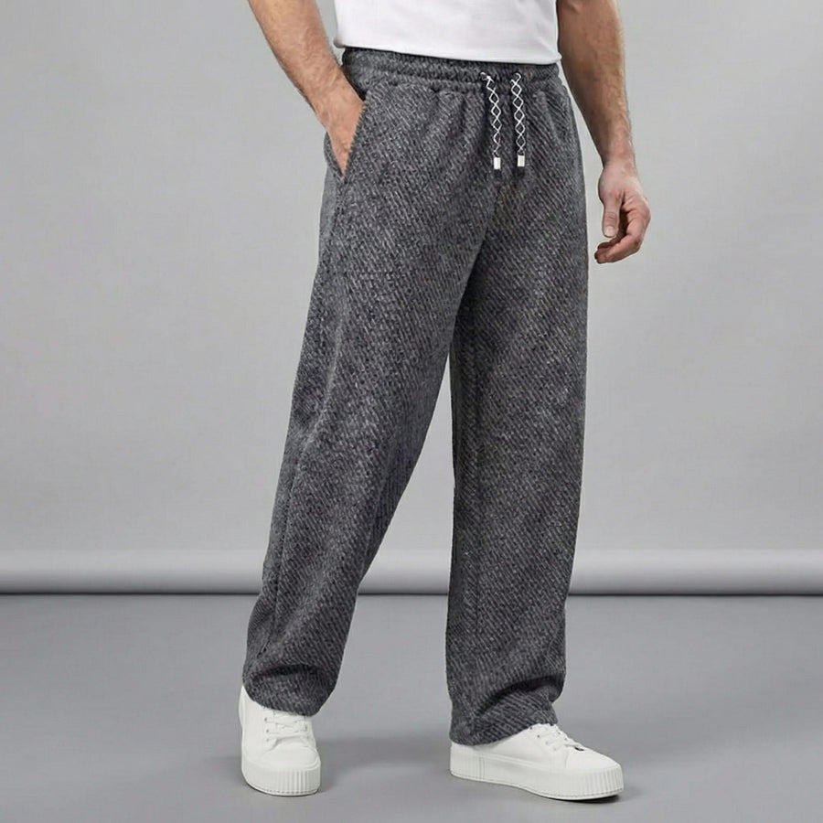 Charcoal textured tapered pants with elastic waistband and drawstring ties