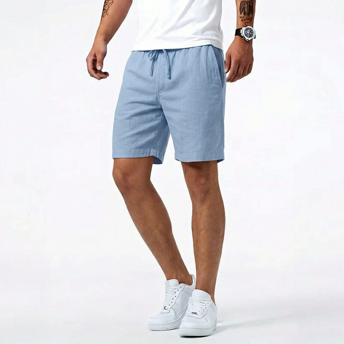 Blue summer shorts with drawstring waistband and side pockets, worn with sneakers