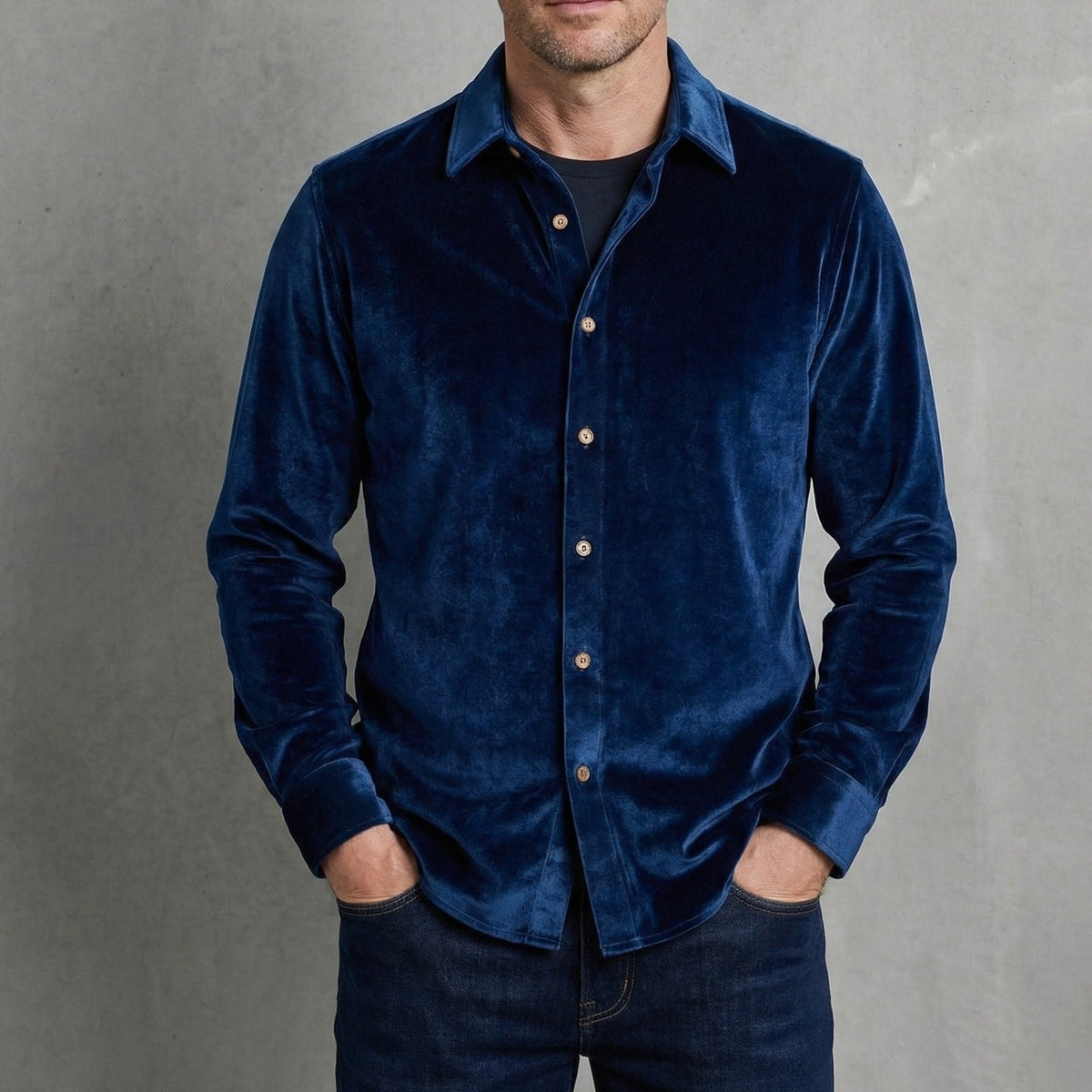Navy velvet button-up shirt with long sleeves and pointed collar.