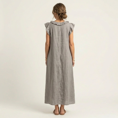 Gray linen maxi dress with ruffled back yoke and short flutter sleeves.