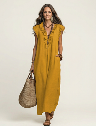 Yellow linen maxi dress with ruffled V-neck and sleeveless ruffle trim.