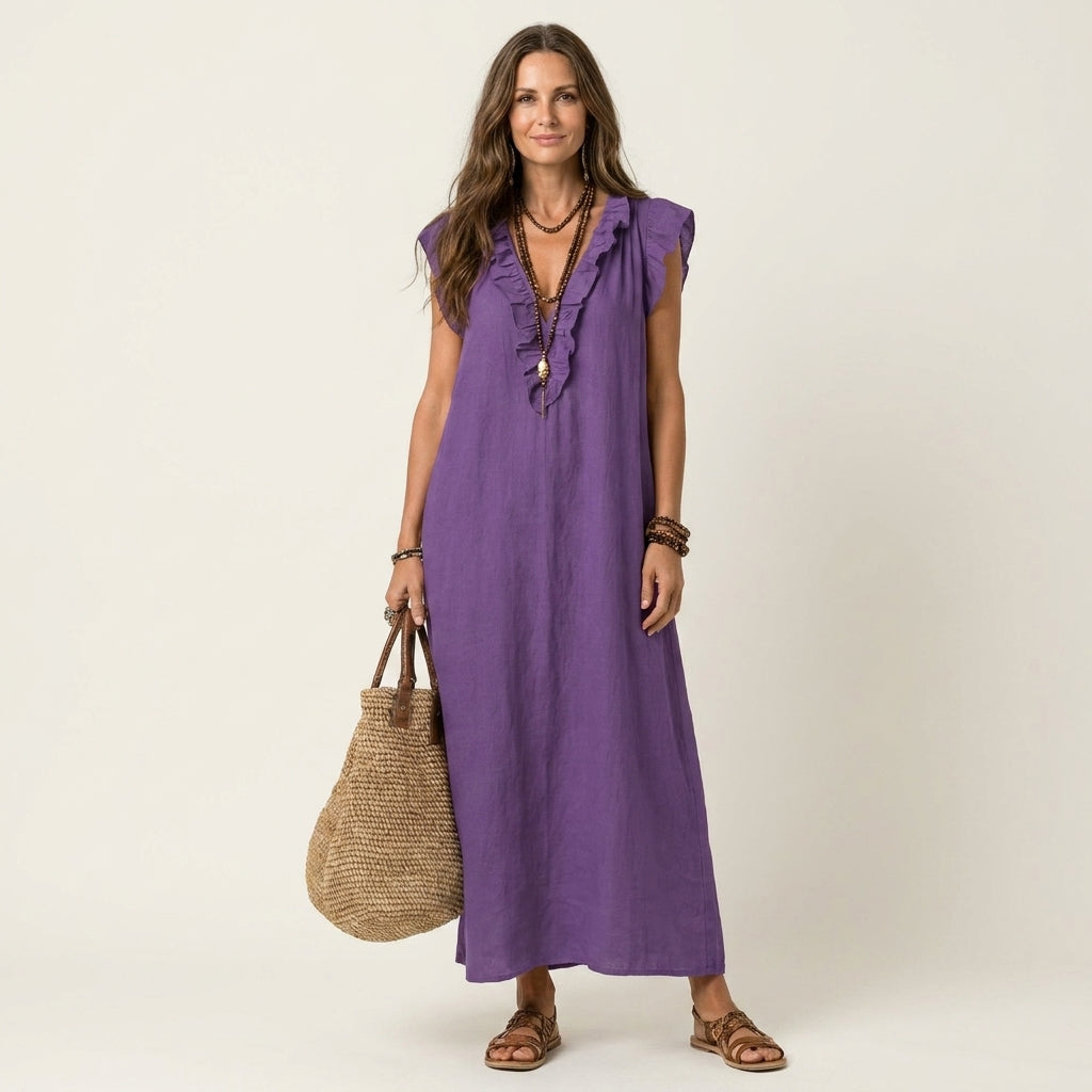 Purple linen maxi dress with ruffled V-neck and sleeveless ruffle detailing.