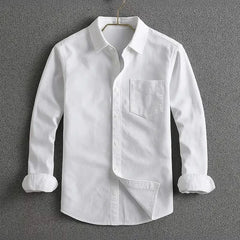 White long-sleeve button-up shirt with chest pocket and diagonal front panel.