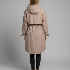 Women's taupe hooded waterproof jacket, back view with cinched waist