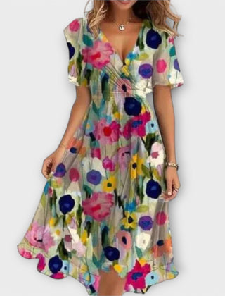 Floral wrap midi dress in multicolor with V-neck and short sleeves, cinched waist, flared skirt