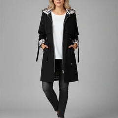Women's black hooded waterproof jacket with plaid inner hood and side ties