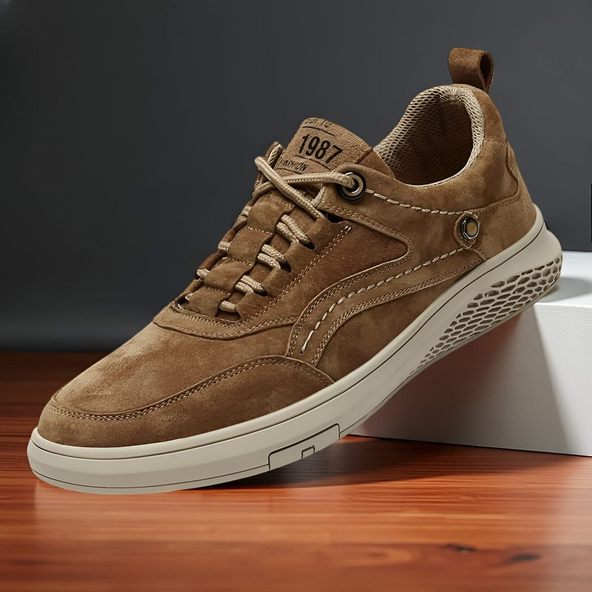 Khaki suede lace-up sneakers with embossed patch detail and white rubber sole