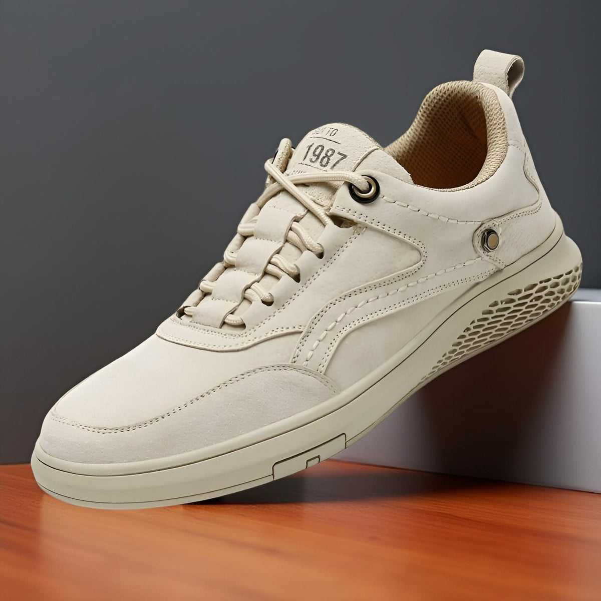 Ivory suede lace-up sneakers with round eyelets and grippy perforated outsole