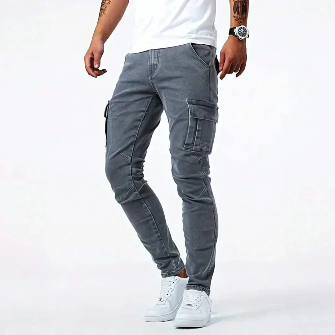 Grey cargo jeans with multiple flap pockets and stitched panel seams