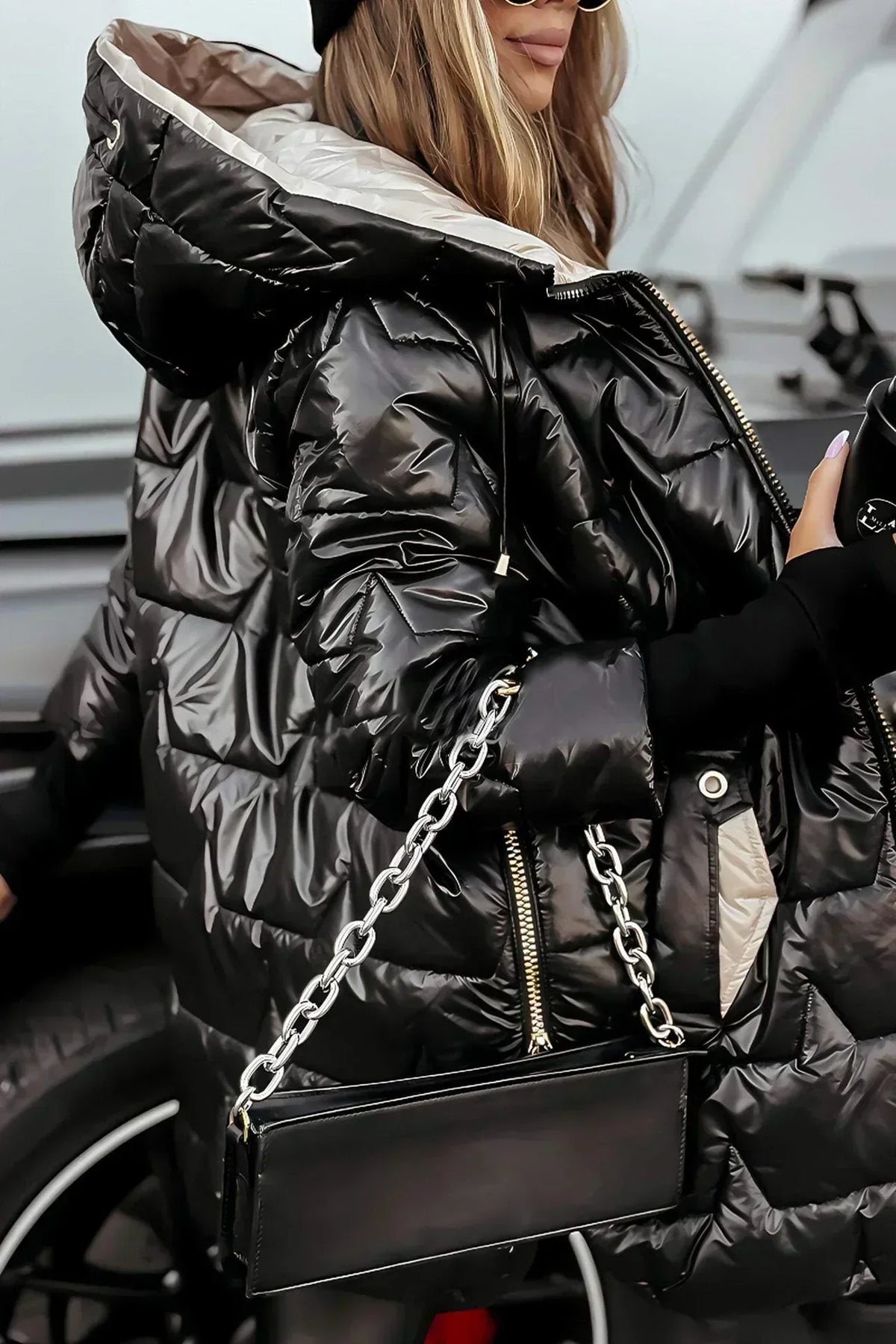 Leviana™ long quilted jacket in black with hood, full front zip, and diamond quilting