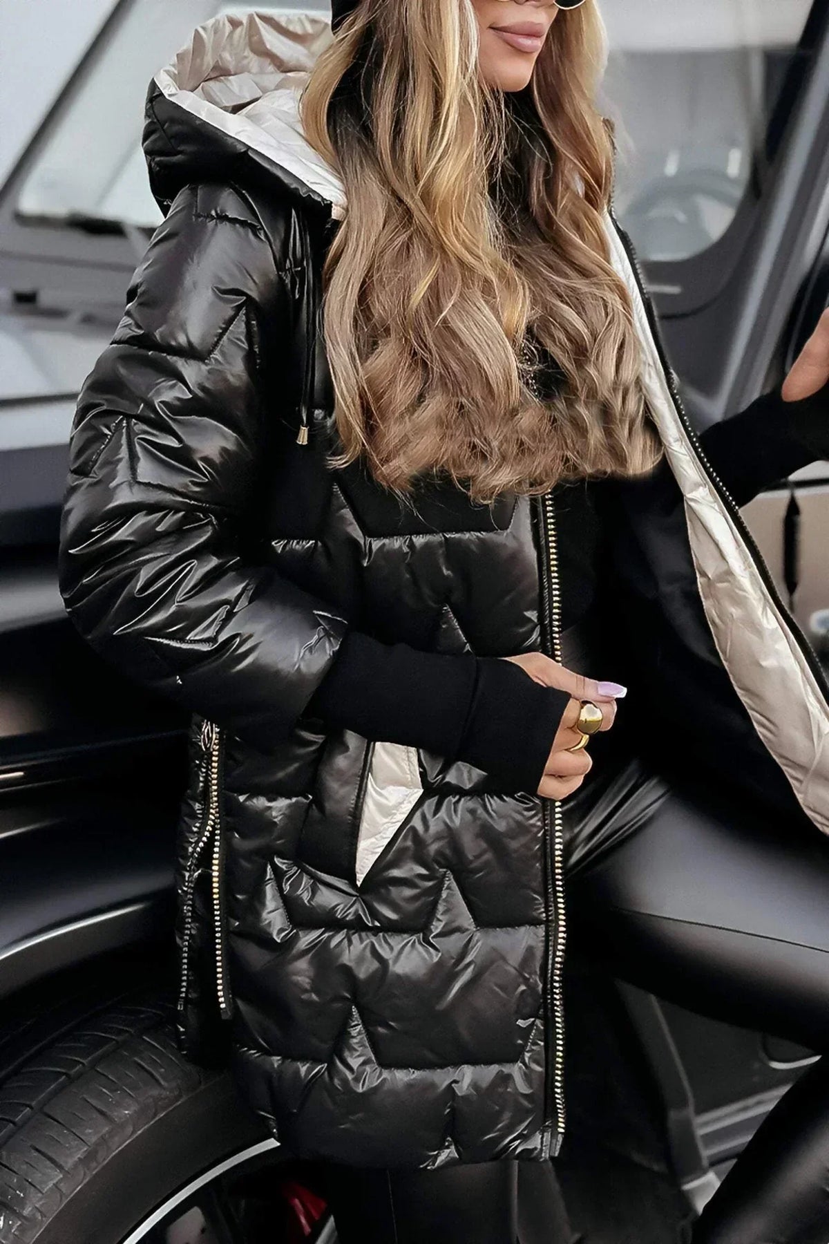 Leviana™ long quilted jacket in black with hood and full front zip, stand collar detail