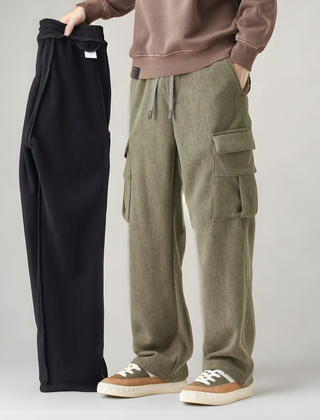 Green cargo pants with drawstring waistband and thigh cargo pocket with flap