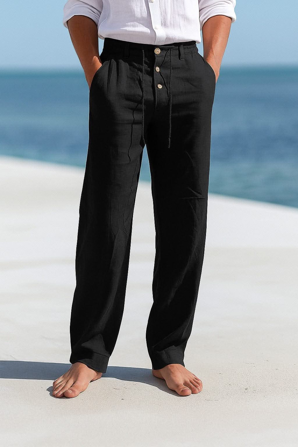 Black linen trousers with button front and drawstring waist, relaxed straight legs
