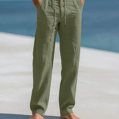 Military green linen trousers with button front and drawstring waist, relaxed straight legs