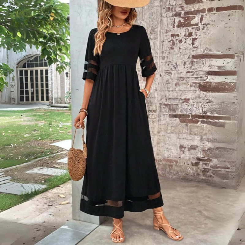Black midi dress with round neck, gathered waist, 3/4 sleeves with sheer stripe hem.
