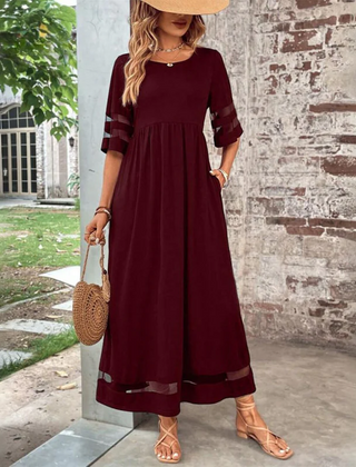 Red midi dress with round neck, gathered waist, 3/4 sleeves with sheer stripe hem.