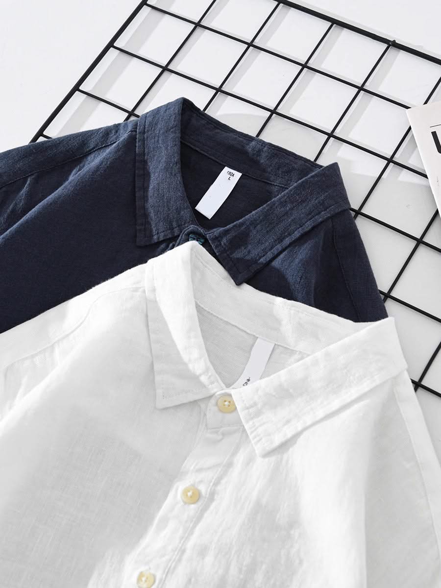 Navy and white collared button-up shirts with chest pockets, long sleeves