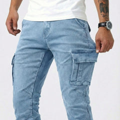 Men's light blue cargo trousers showing front cargo pockets and stitched panels