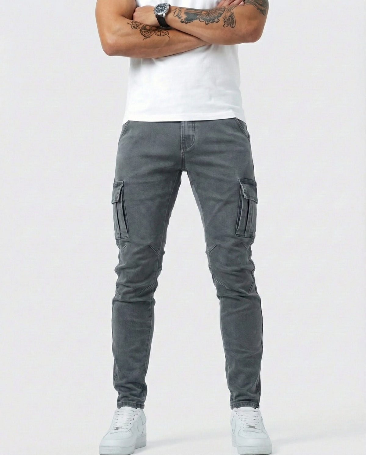 Men's dark grey cargo trousers front view with side cargo pockets and tapered fit