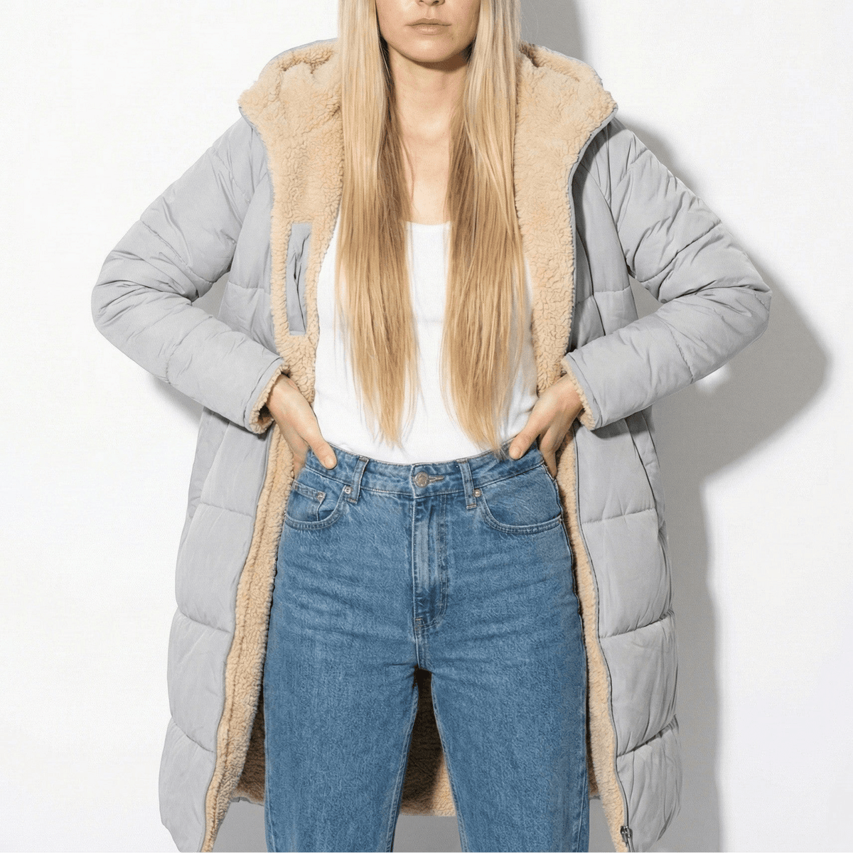 Gray long quilted coat with tan sherpa collar and zip front