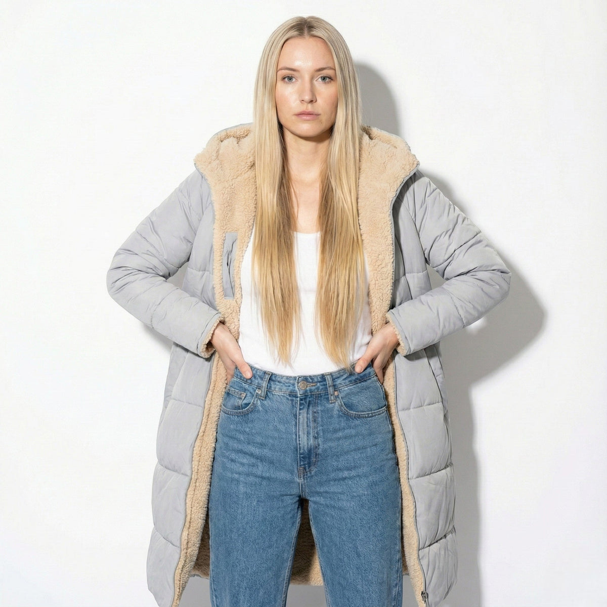 Gray long quilted coat with tan sherpa-lined collar and zip front