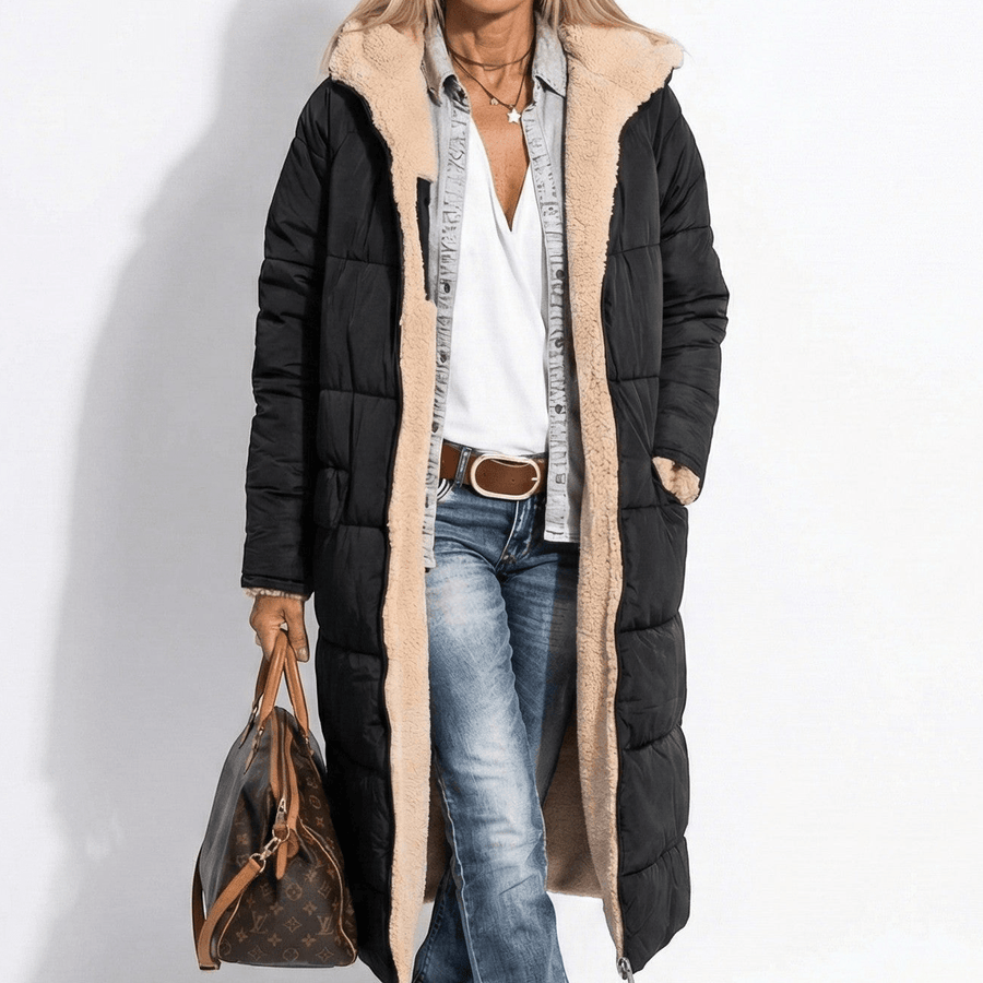 Black long quilted coat with tan sherpa collar and zip front