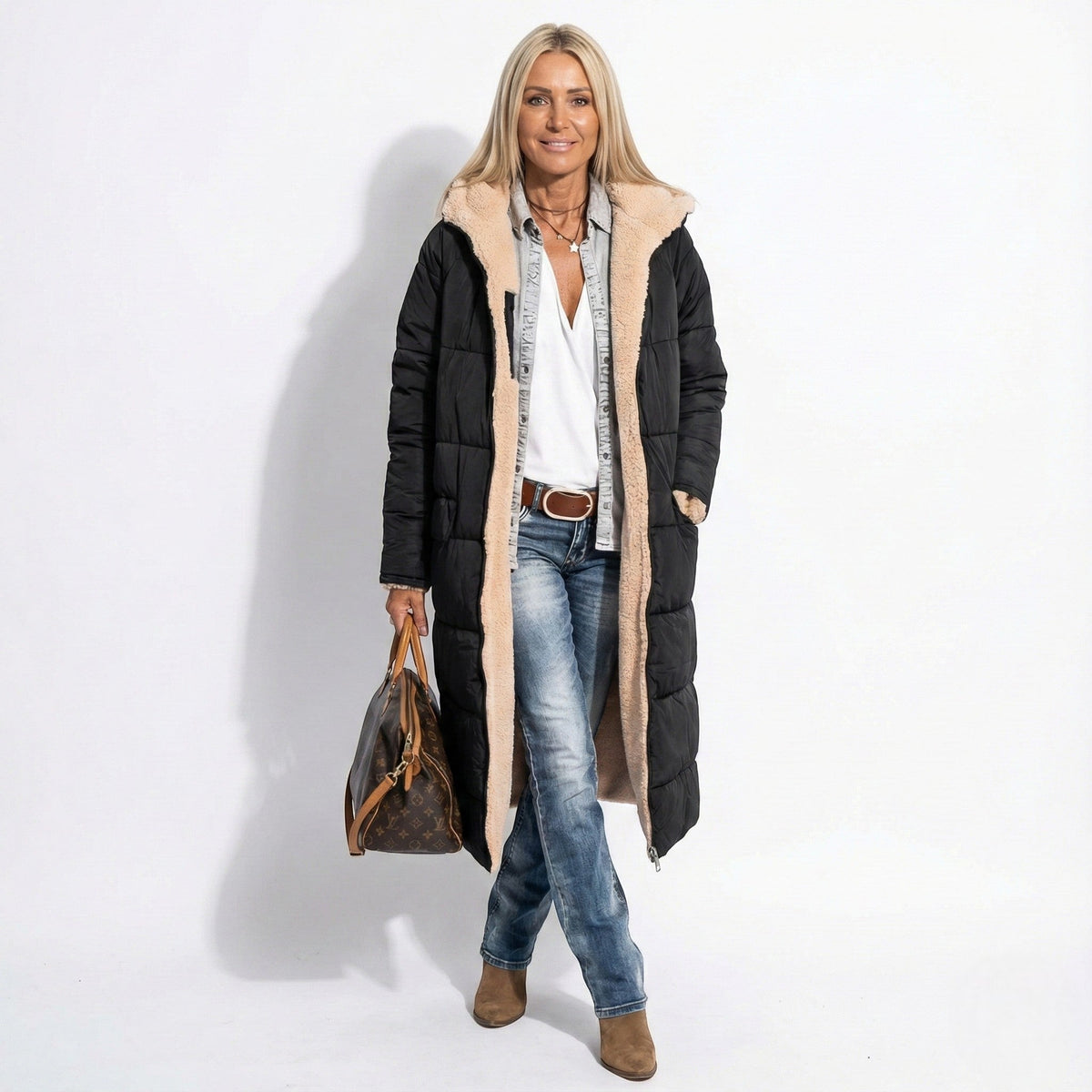 Black long quilted coat with tan sherpa-lined collar and zip front