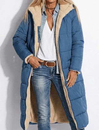 Navy long quilted coat with tan sherpa collar and zip front