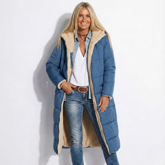 Navy long quilted coat with tan sherpa-lined collar and zip front