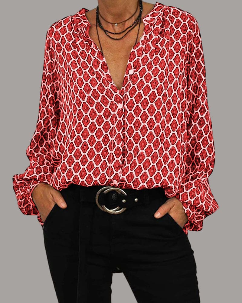 ELVIRA™ red geometric V-neck blouse with long sleeves and front button placket.