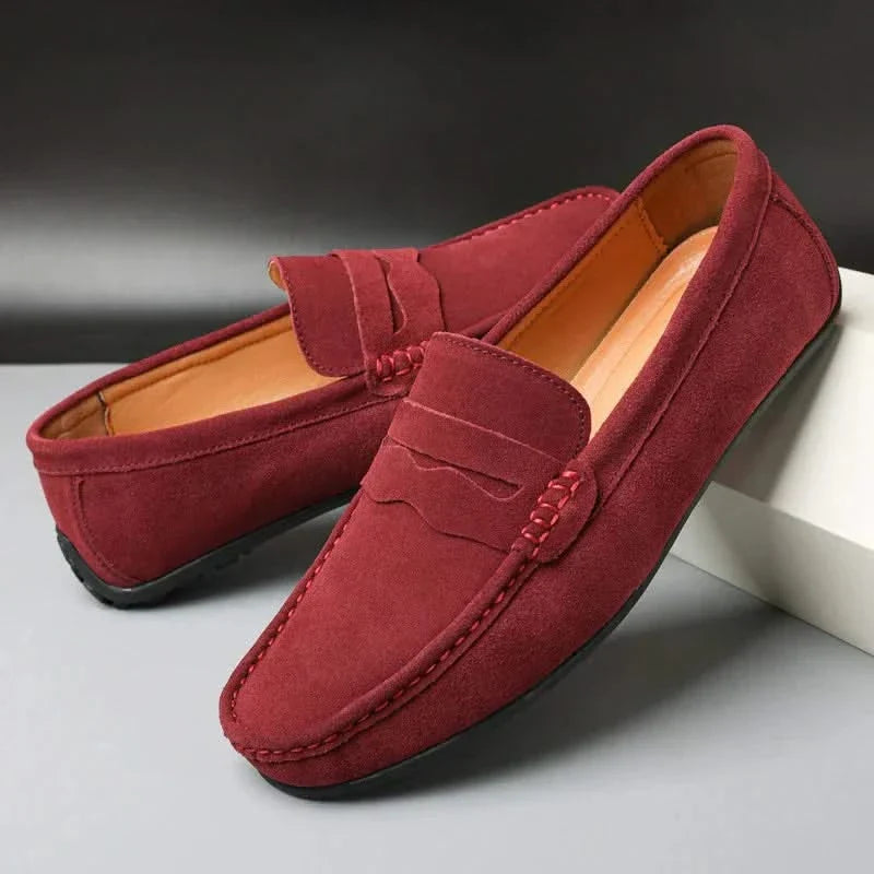 Suede loafers in maroon with penny-style strap and stitched moc toe